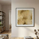 Calavine Sand Bloom Sculptural Leather 3D Wall Art in a slim black frame, displayed on a neutral living room wall beside a bookshelf and dried florals.