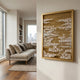 Dynasty Dark Gold Landscape Framed Acrylic 3D Wall Art by Giant Sculptures displayed on a cream wall beside a beige sofa in a modern living room.