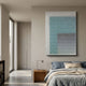Pixelate Sky Frost Acrylic 3D Wall Art by Giant Sculptures displayed above a wooden nightstand in a modern bedroom with blue linen bedding and beige walls.