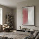Verta Rose Gradient Acrylic 3D Wall Art by Giant Sculptures mounted above a low console in a neutral living room with armchair, bookshelf, and sofa.