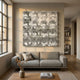 Haloid II Bubble Grid Acrylic 3D Wall Art by Giant Sculptures mounted above a grey sofa with linen cushions in a neutral living room with wood floors.