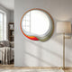 Rippletone Snowcap Red Core Gradient Acrylic UV 3D Wall Art by Giant Sculptures mounted on a pale living room wall beside a brass floor lamp and grey sofa.