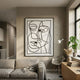 Linea Duo Faces Minimal Acrylic UV 3D Wall Art by Giant Sculptures with black line faces on white panel, displayed above a grey sofa in a modern living room.