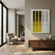 Gradient Yellow & White Stripe Fold Acrylic 3D Wall Art by Giant Sculptures in a slim gold frame, mounted above a walnut sideboard in a modern living room.