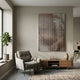 Lattice Mocha Fade Acrylic 3D Wall Art by Giant Sculptures mounted above a walnut media console in a neutral living room with a grey armchair and fiddle leaf plant.