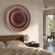 Helix Rosewood Spiral Illusion Acrylic 3D Wall Art by Giant Sculptures mounted above a wooden bed, with paper lantern lamp and balcony view nearby.