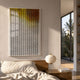 Flux Amber Yellow Gradient Illusion Acrylic 3D Wall Art by Giant Sculptures mounted above a wooden bed with a paper lantern lamp in a sunlit bedroom.