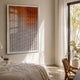 Flux Burnt Orange Gradient Illusion Acrylic 3D Wall Art by Giant Sculptures mounted in a sunlit bedroom above a linen-dressed bed beside a wooden chair.