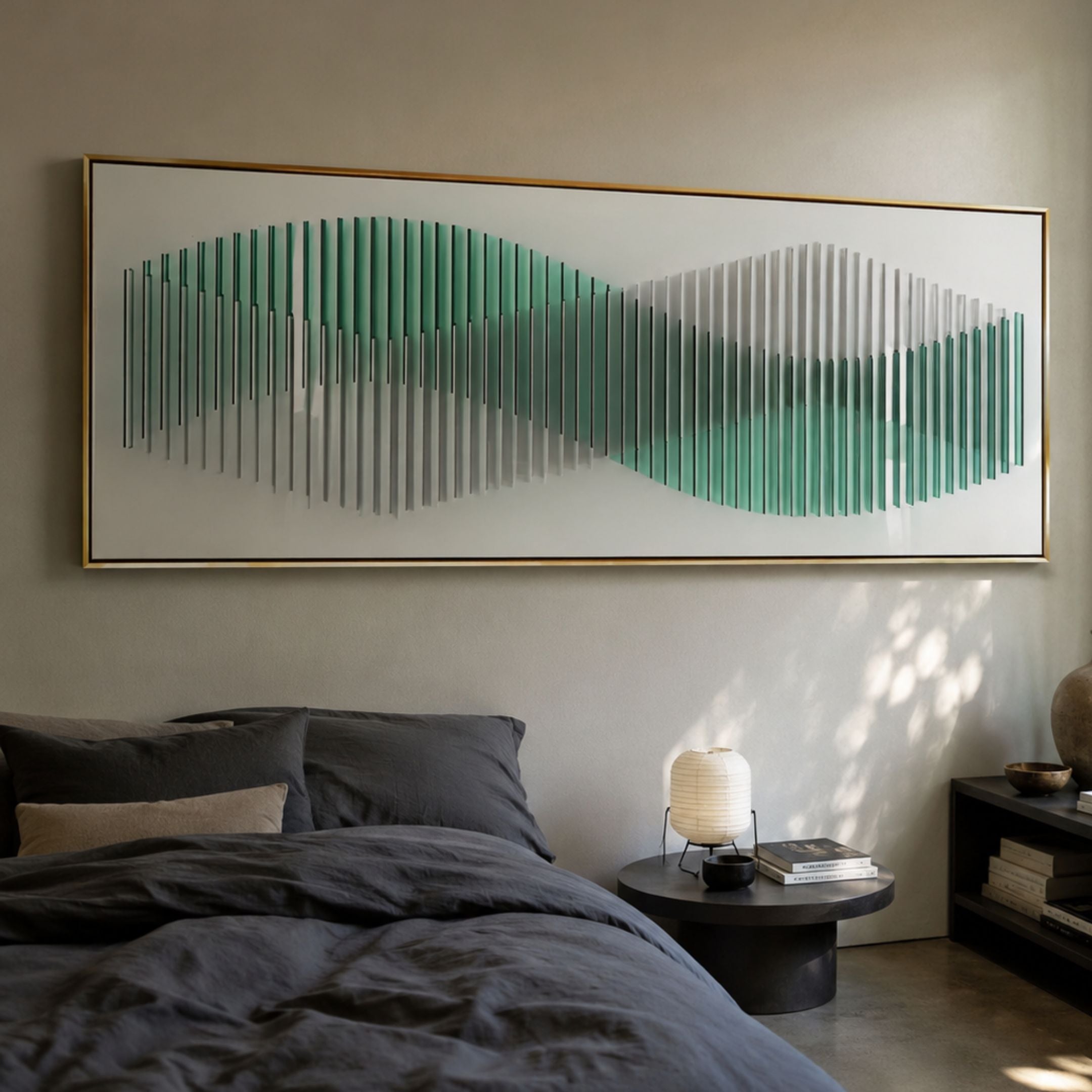 Harmoni Green Gradient Wave Acrylic 3D Wall Art mounted above a bed with grey linens, paper lantern lamp, and dark round side table in a modern bedroom.