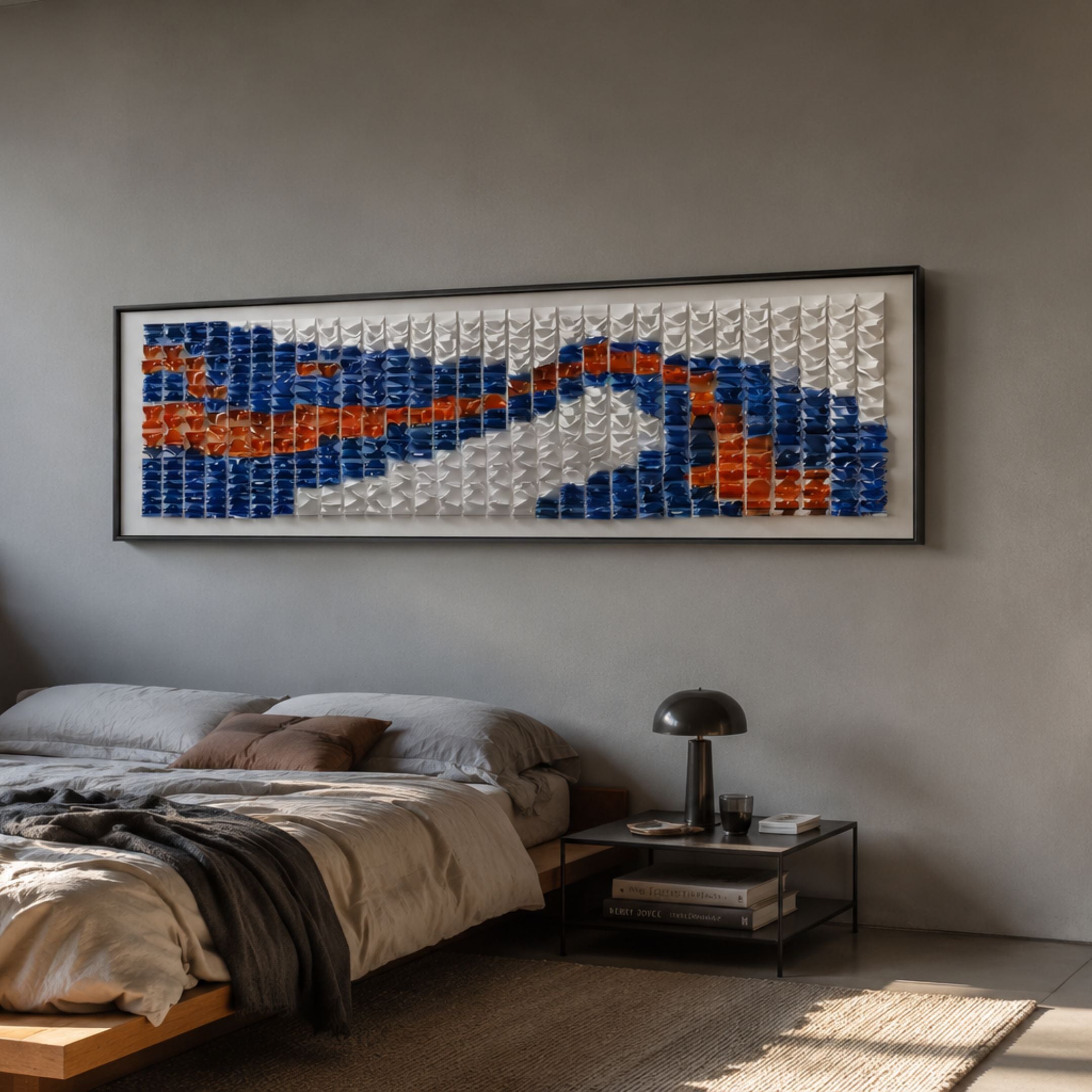 Waveform II Dual Motion Acrylic 3D Wall Art by Giant Sculptures in blue, white, and burnt orange, mounted above a low wooden bed in a grey bedroom.