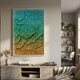 Petalwave Aqua & Coral Organic Flow Leather 3D Wall Art in a white frame, displayed above a concrete console with a record player in a modern living room.