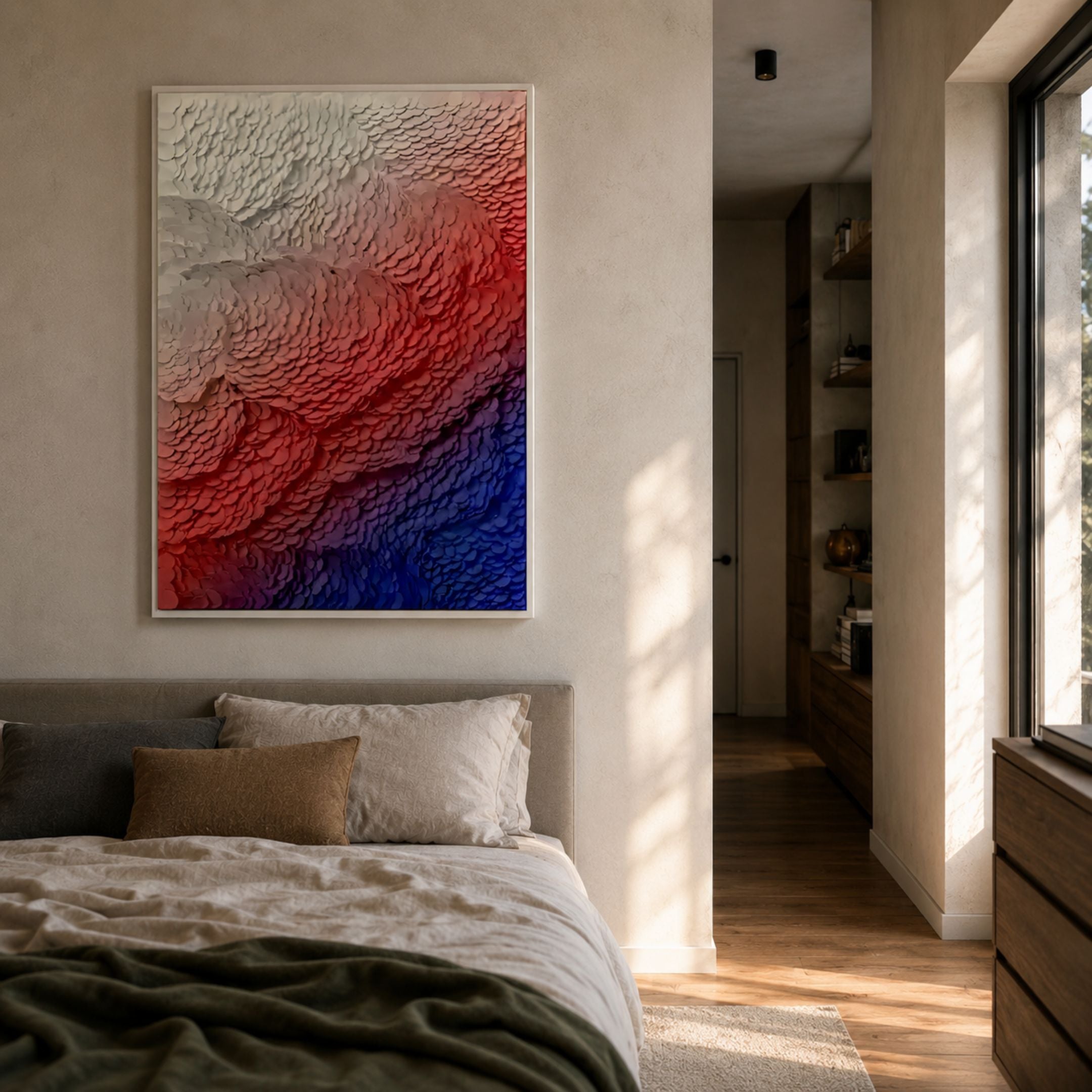 Petalwave Leather 3D Wall Art by Giant Sculptures in a white frame above a bed, showing layered petals in an ivory, red, and indigo gradient.