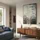 Tidefall Midnight Blue Waters Acrylic & Crystal Beads 3D Wall Art by Giant Sculptures displayed above a walnut sideboard in a living room with a blue sofa.