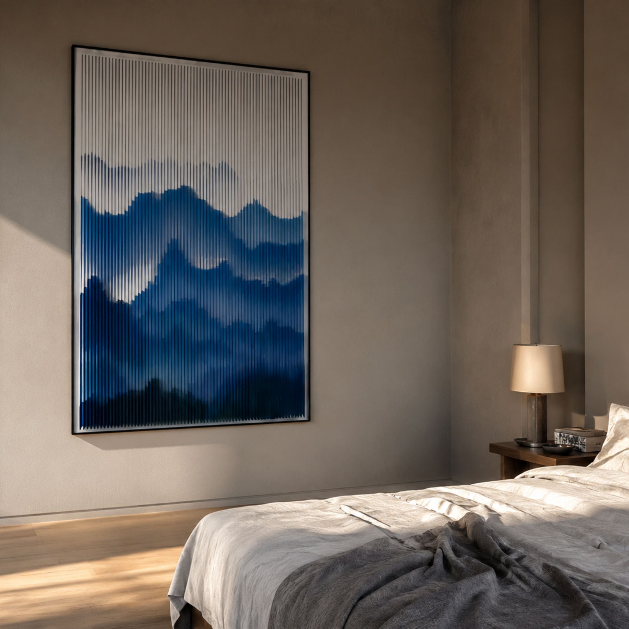 Mistline Indigo Mountain Scene Acrylic 3D Wall Art with ridged indigo mountain layers, framed slim and mounted in a warm bedroom beside a lamp.