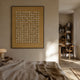 Echoes Mahjong Bamboo & Acrylic 3D Wall Art by Giant Sculptures, framed grid of tan mahjong tiles displayed above a bed in a warm neutral bedroom.