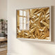 Moden Bronze Metallic Flow Leather 3D Wall Art by Giant Sculptures in a white acrylic box frame, displayed on a cream wall above a console with plants and books.
