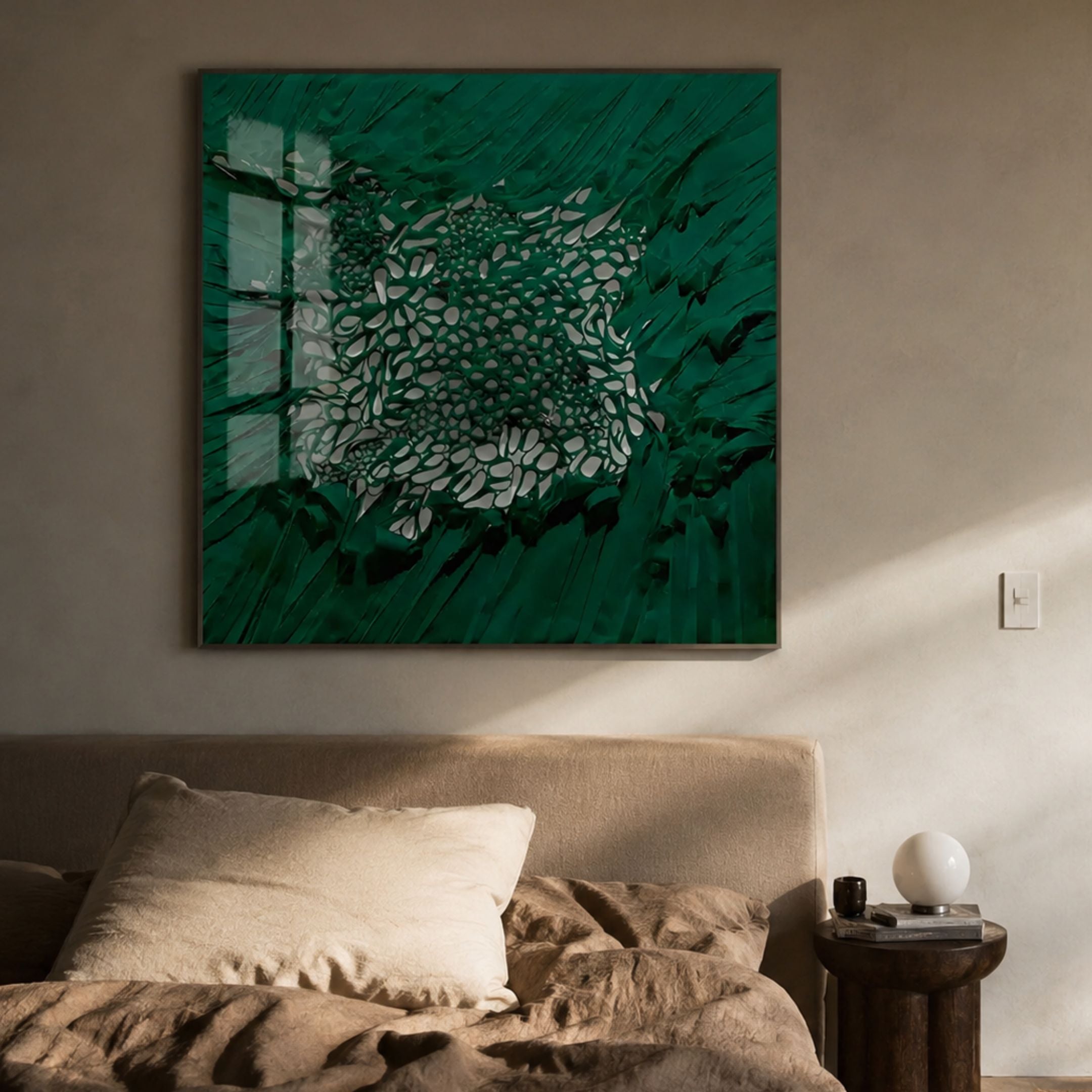 Velorra Emerald Green Bloom Ribbon Acrylic Frame 3D Wall Art by Giant Sculptures mounted above a linen bed with cream pillow and wooden side table.