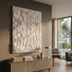 Tessara Ivory Ridge Contour Felt 3D Wall Art by Giant Sculptures displayed above a taupe sideboard with books and brass lamp in a modern living room.