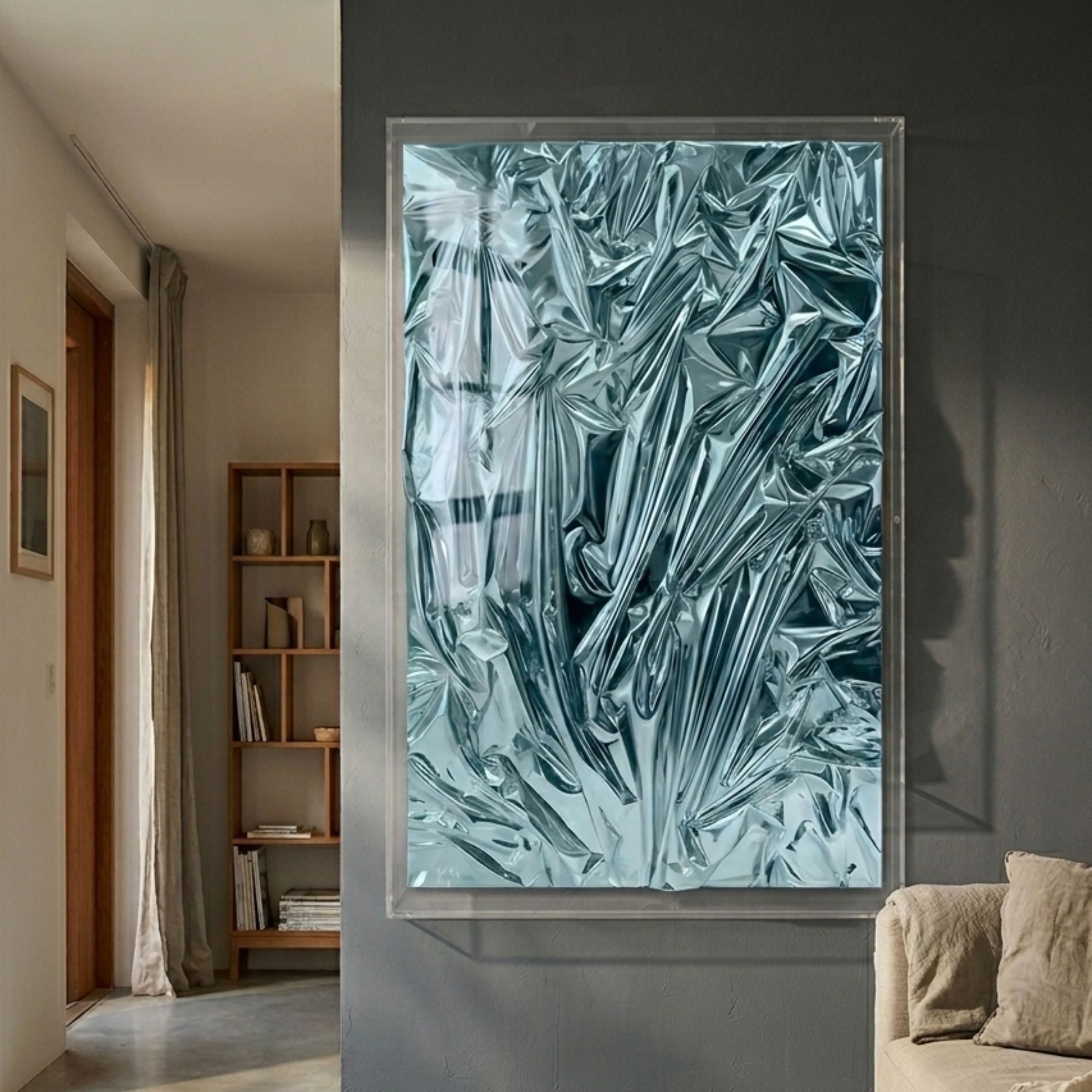 Metallique Ocean Blue Crinkle Texture Leather 3D Wall Art by Giant Sculptures mounted in a clear acrylic frame on a grey wall beside a hallway and bookshelf.