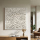Floravia White Ruffled Pedal Leather 3D Wall Art by Giant Sculptures displayed above an oak sideboard with a dried grass vase in a neutral living room.