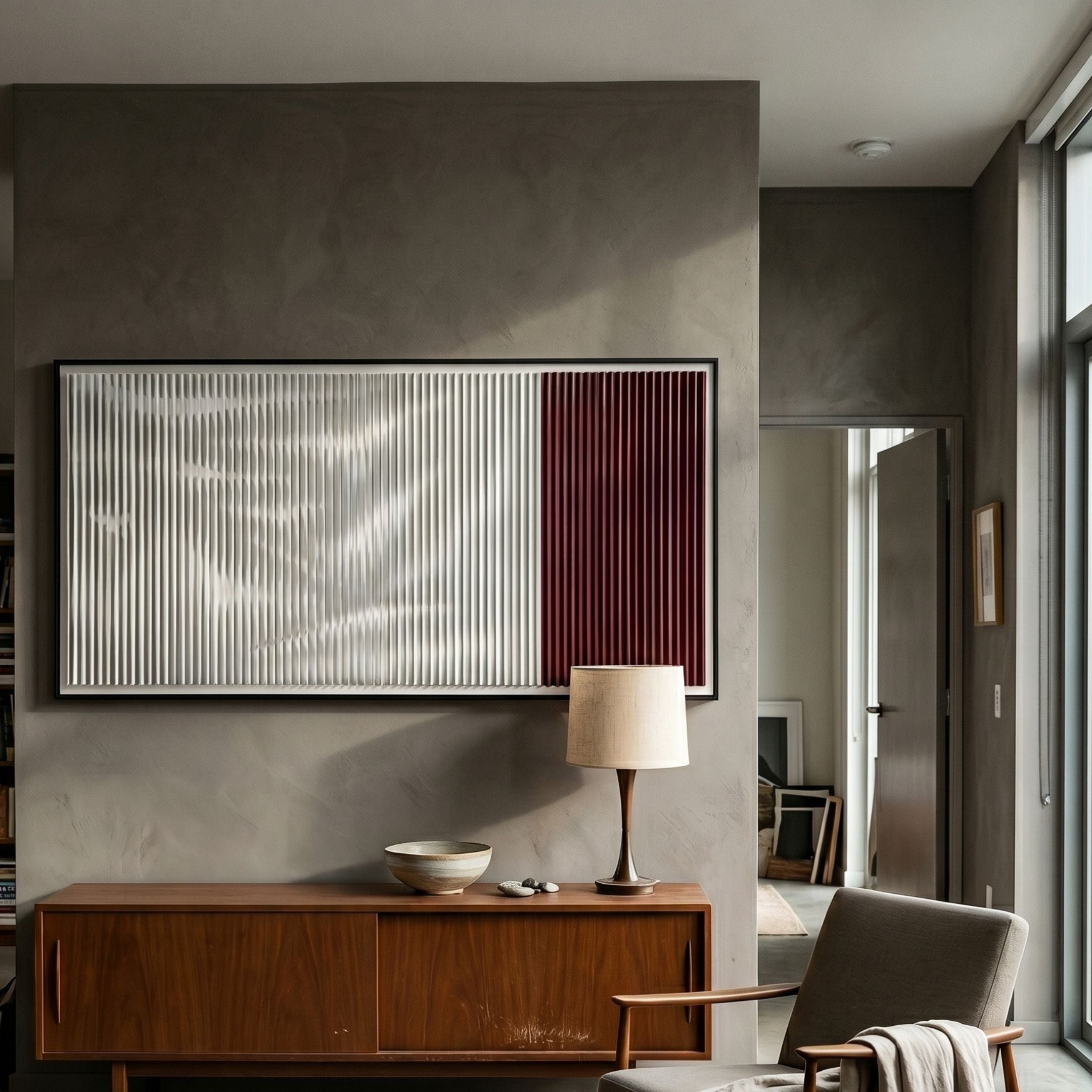 Vistara I Crimson & White Crinkle Texture Acrylic 3D Wall Art by Giant Sculptures mounted above a mid-century walnut sideboard with a lamp in a modern living room.