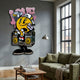Spray Your Love 3D Wall Art by Giant Sculptures, featuring a yellow smiley figure spraying pink LOVE graffiti onto a boombox, mounted on a grey living room wall.