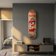 Kuman Boy Deck Vol.1 Skateboard Wall Art mounted on a grey wall above a wooden media console with a record player, beside a bedroom doorway.