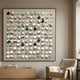 Formexa Cube Geometric Wood Relief 3D Wall Art by Giant Sculptures, framed grid of tilted cubes in white, beige, green, teal, and red above a sideboard.