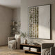 Aestilis Olive & White Mosaic Wood Carving 3D Wall Art by Giant Sculptures mounted in a neutral living room above a wood console with linen armchair and olive sprig.