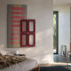 Lineris Red Oil Painting & Glossy Wood Relief 3D Wall Art by Giant Sculptures, shown above a bed with red and beige stripes layered under a glossy red cutout panel.