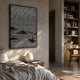 Synova Silver II Hand-Painted Wood Relief 3D Wall Art by Giant Sculptures, mounted above a bed with a paper lantern, beside built-in bookshelves in a warm room.