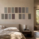 Eximia Neutral Tones Multi-Panel Wood Relief 3D Wall Art by Giant Sculptures displayed in two rows above an upholstered bed with linen bedding and wooden nightstand.