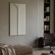 Eximia White Minimalist Wood Relief 3D Wall Art by Giant Sculptures displayed on a beige wall above a linen daybed, beside a dark bookshelf and leather chair.