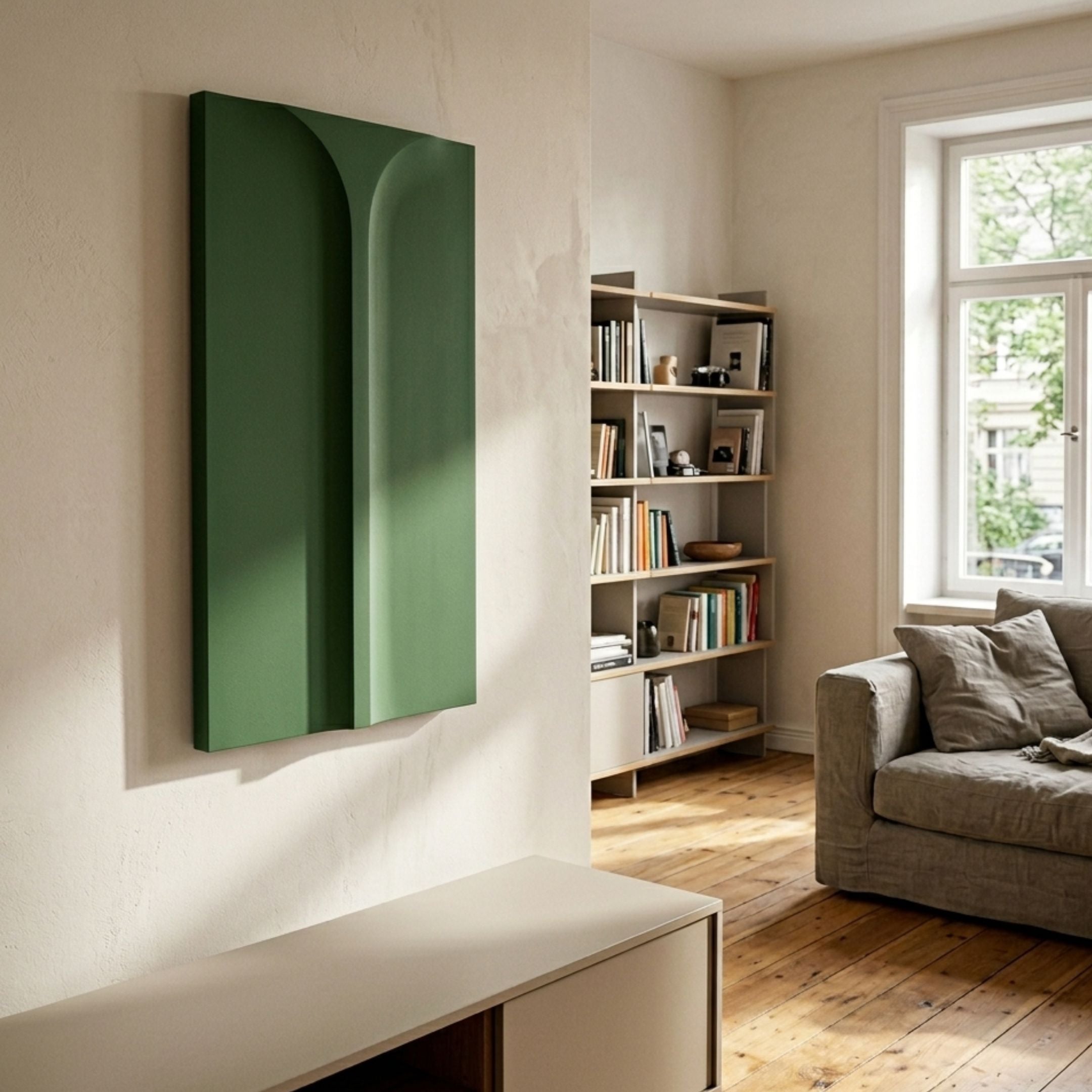 Eximia Green Minimalist Wood Relief 3D Wall Art with layered arch and column forms in sage to forest tones, mounted in a sunlit living room beside a bookshelf.