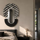 Arcus Black & White Zebra Stripes Mirror 3D Wooden Wall Art mounted above a grey upholstered bed with a mushroom lamp on the bedside table.