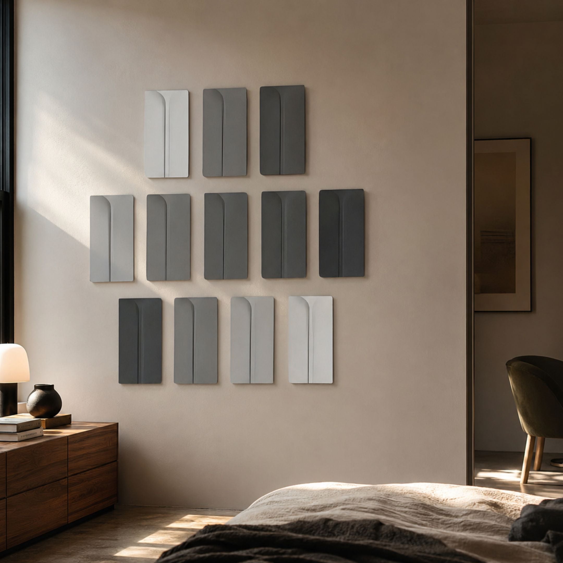 Eximia Grayscale Multi-Panel Wood Relief 3D Wall Art by Giant Sculptures displayed in a bedroom above a walnut dresser, arranged in three rows of carved panels.