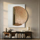 Artevia Gold & White Geometric Wood Relief 3D Wall Art displayed above a dark console with books, vases, and a lamp in a neutral living space.