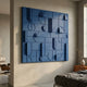 Grida Midnight Blue II Wood Carving 3D Wall Art by Giant Sculptures mounted in a bedroom above a bed, beside an Eames lounge chair and timber dresser.