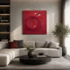 Solveta Red Spiral Wood Relief 3D Wall Art by Giant Sculptures mounted above a grey sectional sofa with black round coffee table and olive tree in a modern living room.