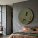 Arcuza Olive III Wood Carving Sandstone 3D Wall Art mounted on a grey bedroom wall above a leather bed with terracotta and green linens.