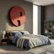 Arcuza Burgundy III Wood Carving Sandstone 3D Wall Art by Giant Sculptures, a matte red circular disc with carved arch and window cutouts above a bed.