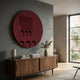 Arcuza Burgundy I Wood Carving Sandstone 3D Wall Art by Giant Sculptures mounted above a walnut sideboard with books, lamp and eucalyptus vase in a grey room.