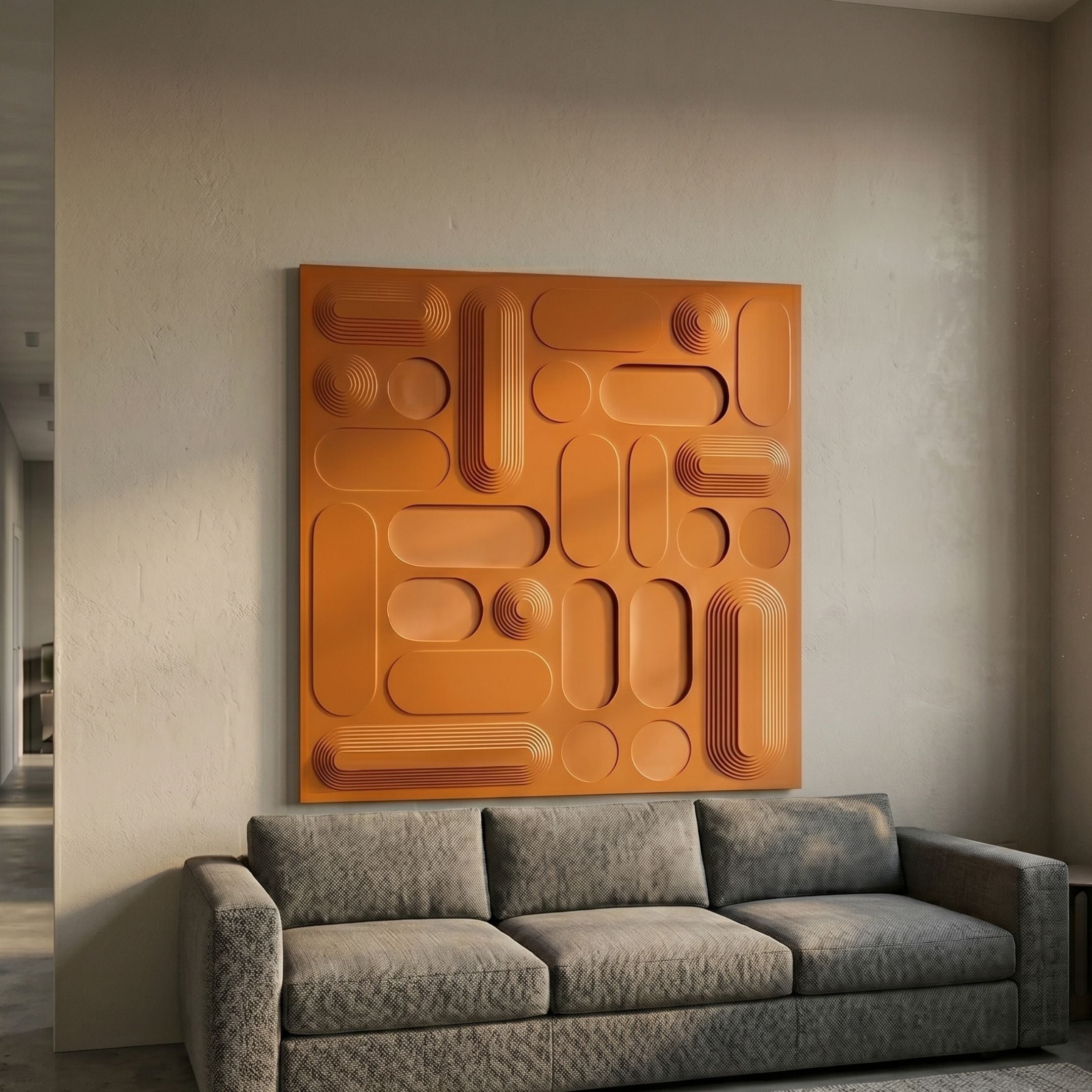 Grida Burnt Orange Wood Carving 3D Wall Art by Giant Sculptures, a square panel of raised rectangles, discs and curves, mounted above a grey sofa.