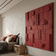 Grida Brick Red II Wood Carving 3D Wall Art by Giant Sculptures mounted in a modern bedroom beside a bed with rust pillows and a wooden nightstand.