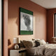Edge Forest Green David Bust 3D Wall Art by Giant Sculptures displayed above a linen bed and ceramic lamp in a terracotta-walled bedroom.