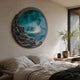 Auroria Golden Ember Hand-Painted Wood Relief 3D Wall Art with turquoise painterly centre and rugged black rim, mounted above a bed in a neutral bedroom.