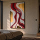Marea Organic Flow Crimson & Gold Wood Relief 3D Wall Art by Giant Sculptures displayed on a warm beige bedroom wall above a linen-dressed bed.