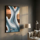 Marea Organic Flow Teal & Copper Wood Relief 3D Wall Art by Giant Sculptures, mounted on a grey wall beside a floor lamp and beige armchair in a living room.