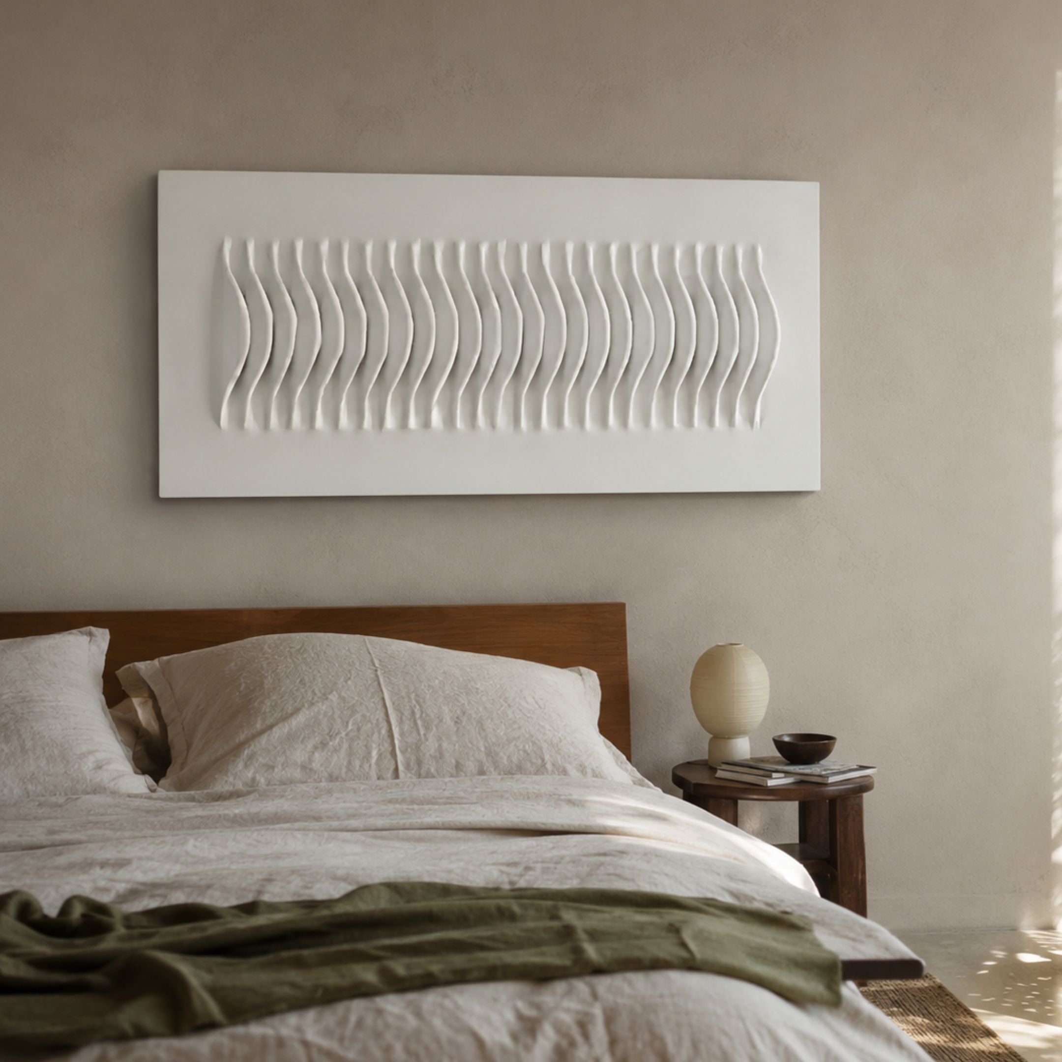 Ondara Wave White Horizontal Wood Relief 3D Wall Art mounted above a walnut bed with linen bedding, beside a wooden nightstand with a ceramic lamp.