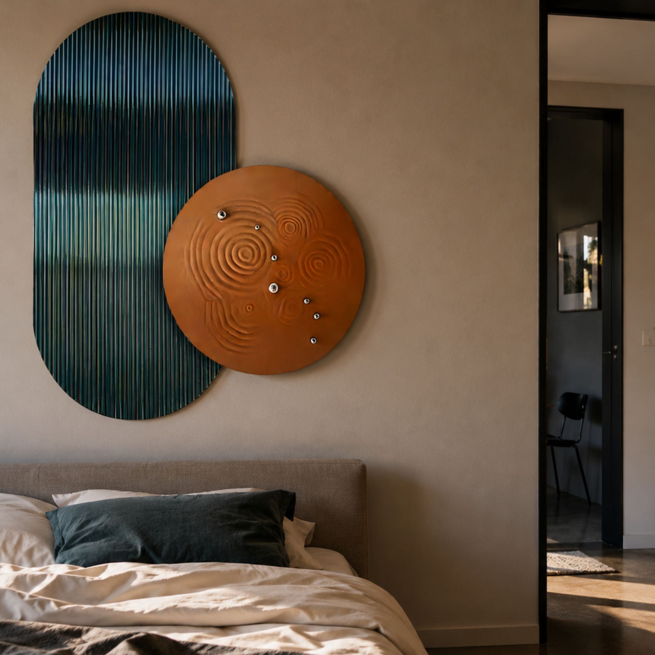 Embera Abstract Circle Teal Ombre 3D Wall Art by Giant Sculptures, with a ribbed teal oval and bronze disc, mounted above a bed in a modern bedroom.